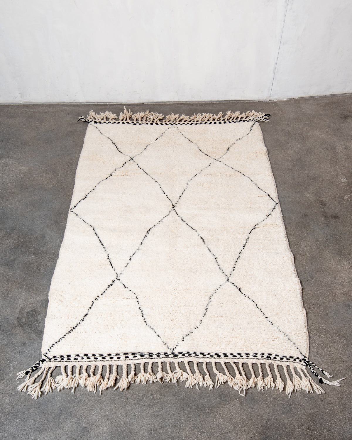 Modern, designer, handcrafted Berber rug from Morocco. Beniourain carpet with minimalist design, natural wool pile and a fluffy texture.